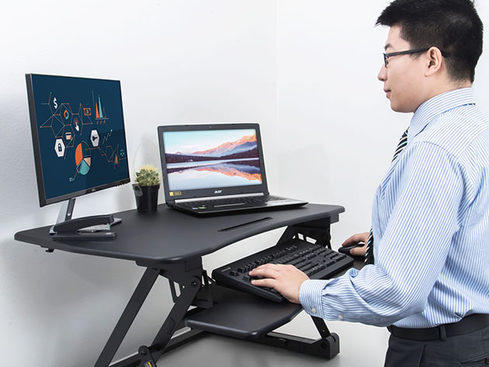 MacTrast Deals: This Adjustable Standing Desk Converter Allows You to Work on Important Tasks with Ease & Comfort